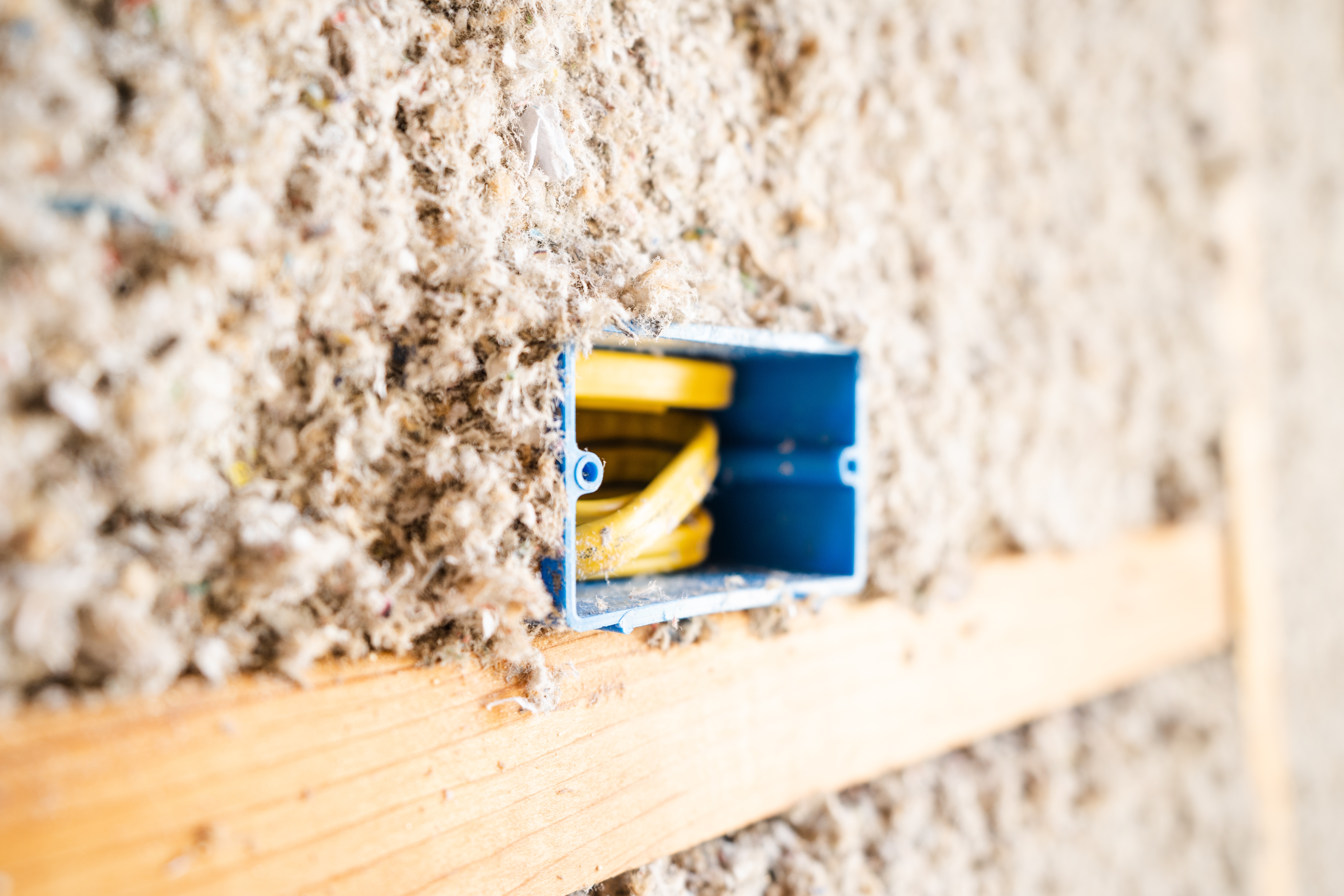 close up of cellulose insulation in an interior wall